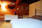 medieval style brick wall and double bed