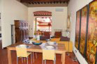 large living and dining area with sun room