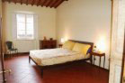 bedroom on the main level with a queen bed