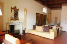 living and dining area with marble fireplace